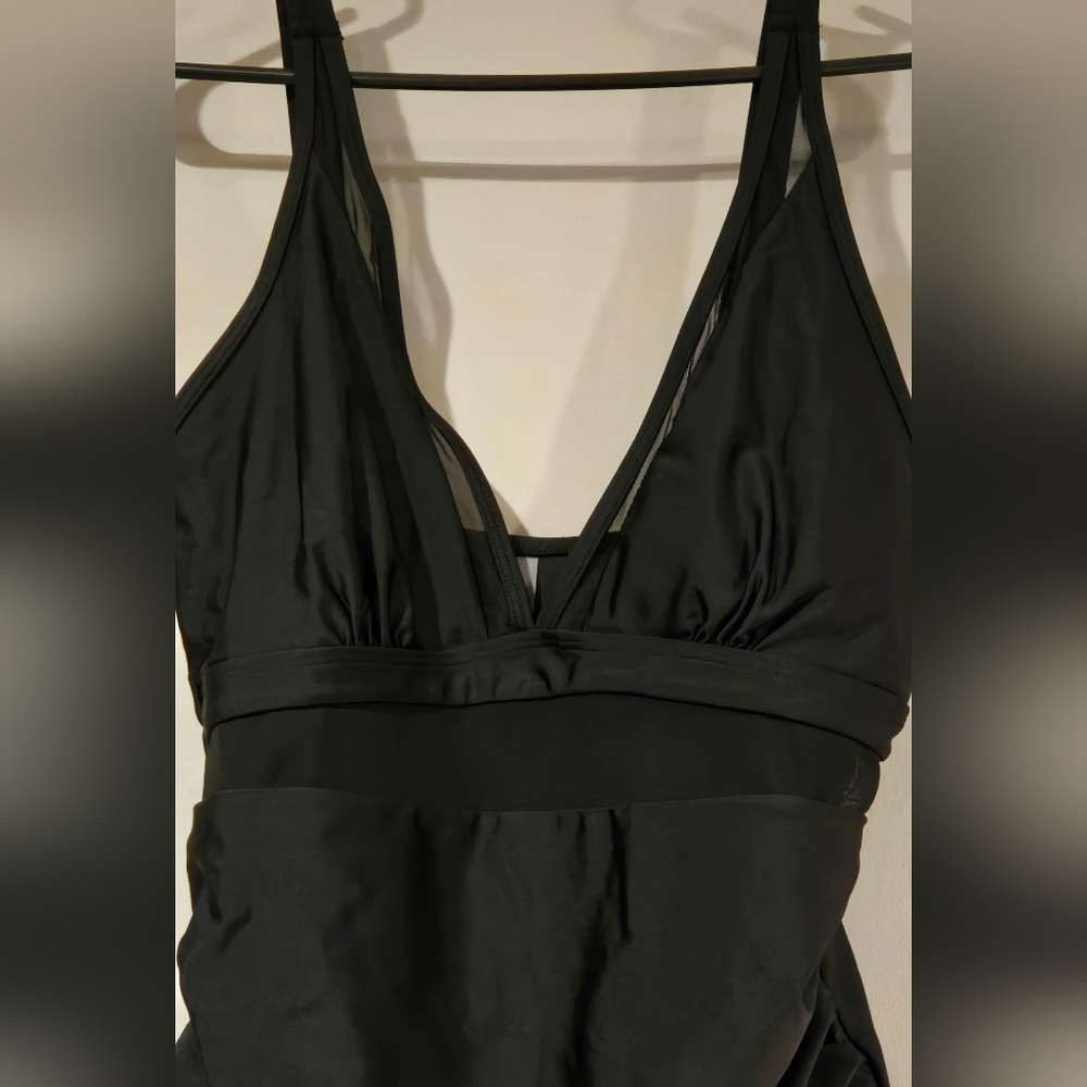Lnwot black one piece swimsuit sz L. Has mesh detail at breast and midsection.